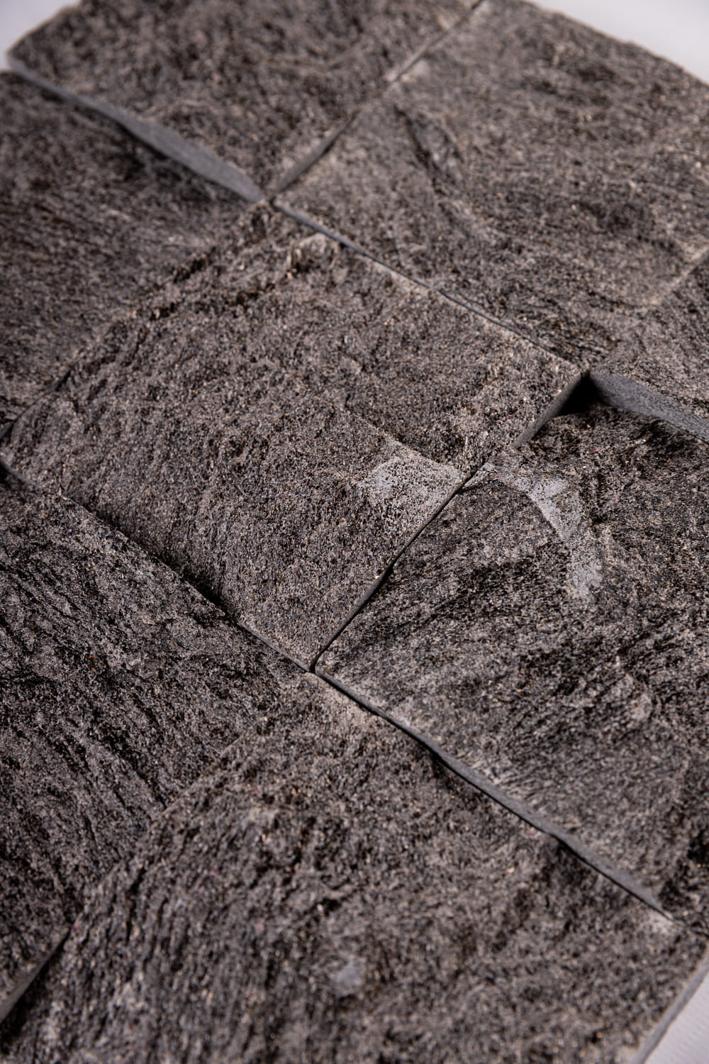 PEDRA CARBONE BRUTA 10x10